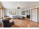 Bright living room area with open access to the kitchen and gorgeous hardwood floors at 860 Zenobia St, Denver, CO 80204