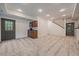 Spacious finished basement featuring carpet, a wet bar, and easy access to the exterior at 27756 Troublesome Gulch Rd, Evergreen, CO 80439