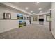 Finished basement area featuring neutral carpet, recessed lighting and wall decor at 27756 Troublesome Gulch Rd, Evergreen, CO 80439