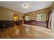 Spacious bedroom features hardwood flooring, with large windows and neutral color scheme at 27756 Troublesome Gulch Rd, Evergreen, CO 80439