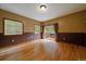 Bedroom with hardwood floors, natural light, and a sliding glass door to the deck at 27756 Troublesome Gulch Rd, Evergreen, CO 80439