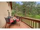 Large outdoor deck area with an open view and comfortable seating at 27756 Troublesome Gulch Rd, Evergreen, CO 80439