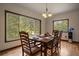 Dining room with natural lighting and views to a peaceful outdoors at 27756 Troublesome Gulch Rd, Evergreen, CO 80439
