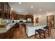 Updated kitchen with stainless steel appliances, granite counters, and wooden floors at 27756 Troublesome Gulch Rd, Evergreen, CO 80439