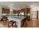 Bright kitchen featuring a large island with seating and granite countertops at 27756 Troublesome Gulch Rd, Evergreen, CO 80439