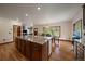Spacious kitchen with a large island overlooking the dining and living areas at 27756 Troublesome Gulch Rd, Evergreen, CO 80439