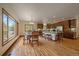 Open kitchen features wood floors, spacious island, and stainless appliances at 27756 Troublesome Gulch Rd, Evergreen, CO 80439