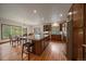 Eat in kitchen featuring a large island with seating and stainless appliances at 27756 Troublesome Gulch Rd, Evergreen, CO 80439