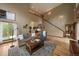 Spacious living area featuring hardwood floors and an open floor plan at 27756 Troublesome Gulch Rd, Evergreen, CO 80439
