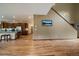 Open floor plan that flows to the kitchen area and hardwood flooring at 27756 Troublesome Gulch Rd, Evergreen, CO 80439