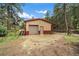 Exterior view of garage or outbuilding at 27756 Troublesome Gulch Rd, Evergreen, CO 80439