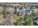 Aerial view showcasing a home with a large backyard, deck, and surrounding neighborhood at 7411 S Curtice Ct, Littleton, CO 80120