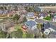Bird's eye view of a home nestled among trees in a suburban neighborhood at 7411 S Curtice Ct, Littleton, CO 80120