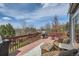 Outdoor deck featuring lounge chairs, dining furniture, and stunning scenic views at 7411 S Curtice Ct, Littleton, CO 80120