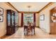Formal dining room with hardwood floors, window, and elegant furniture at 7411 S Curtice Ct, Littleton, CO 80120