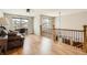 Bright living space featuring hardwood floors, a ceiling fan, and a comfortable seating area with lots of natural light at 7411 S Curtice Ct, Littleton, CO 80120