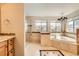 A spa-like bathroom featuring a soaking tub, glass-enclosed shower, and elegant tile work and finishes at 7411 S Curtice Ct, Littleton, CO 80120