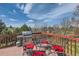 Outdoor deck with grill and table for outdoor dining, all with stunning views at 7411 S Curtice Ct, Littleton, CO 80120