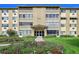 Apartment building showcasing its facade, well-manicured lawn, and inviting entrance at 635 S Alton Way # 6A, Denver, CO 80247