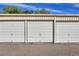 Three-car detached garages providing ample parking and storage space for residents at 635 S Alton Way # 6A, Denver, CO 80247