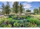 Stunning flower gardens with walking paths and water features create a tranquil outdoor oasis at 635 S Alton Way # 6A, Denver, CO 80247