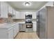 Modern kitchen with stainless steel appliances and updated cabinets at 635 S Alton Way # 6A, Denver, CO 80247