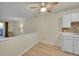 Cozy living room featuring wood flooring and a ceiling fan for added comfort at 635 S Alton Way # 6A, Denver, CO 80247