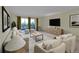 Bright living room with neutral tones, balcony access, modern furniture and decor at 635 S Alton Way # 6A, Denver, CO 80247