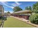 Large patio area with covered seating and outdoor grills perfect for entertaining and enjoying the outdoors at 635 S Alton Way # 6A, Denver, CO 80247