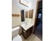 Simple bathroom with a single sink and standard toilet and mirror at 17969 E Brown Pl, Aurora, CO 80013