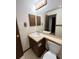 Bathroom showcasing tile countertops, a mirror, and standard fixtures at 17969 E Brown Pl, Aurora, CO 80013