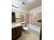 Bathroom features a combined bathtub and shower, single sink and tile flooring at 17969 E Brown Pl, Aurora, CO 80013