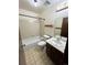 Bathroom featuring a combination tub and shower, a single sink and tile floors at 17969 E Brown Pl, Aurora, CO 80013