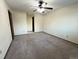 Bedroom including a ceiling fan and an adjacent room at 17969 E Brown Pl, Aurora, CO 80013
