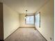 Dining room with carpet, a window and a chandelier that offers a perfect space for meals at 17969 E Brown Pl, Aurora, CO 80013