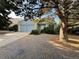 Quaint single Gathering home with a two-car garage, surrounded by mature trees and simple landscaping at 17969 E Brown Pl, Aurora, CO 80013