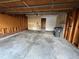 Spacious unfinished garage with concrete floor, door and overhead door at 17969 E Brown Pl, Aurora, CO 80013