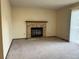 Cozy living room featuring a brick fireplace, carpet and a sliding glass door at 17969 E Brown Pl, Aurora, CO 80013