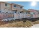 Private backyard with wooden fence and small grassy area at 1179 S Waco St # E, Aurora, CO 80017