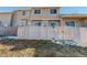 Private backyard with wooden fence and small grassy area at 1179 S Waco St # E, Aurora, CO 80017