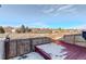 Small backyard with deck and fence, offering privacy and outdoor space at 1179 S Waco St # E, Aurora, CO 80017