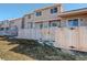 Private backyard with wooden fence and small grassy area at 1179 S Waco St # E, Aurora, CO 80017