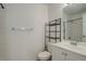 Clean bathroom with white vanity, toilet, and shower at 1179 S Waco St # E, Aurora, CO 80017