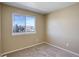Bright bedroom with neutral walls and carpet at 1179 S Waco St # E, Aurora, CO 80017