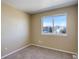 Bright bedroom with neutral walls and carpet at 1179 S Waco St # E, Aurora, CO 80017