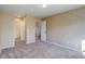Bedroom with carpet, neutral walls, and access to bathroom and closets at 1179 S Waco St # E, Aurora, CO 80017