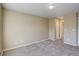 Bright bedroom featuring neutral walls, carpet, and ample closet space at 1179 S Waco St # E, Aurora, CO 80017