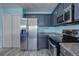 Modern kitchen with stainless steel appliances and granite counters at 1179 S Waco St # E, Aurora, CO 80017