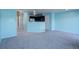 Open kitchen with dark cabinetry and breakfast bar at 1179 S Waco St # E, Aurora, CO 80017