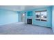 Living room with fireplace and sliding glass doors to patio at 1179 S Waco St # E, Aurora, CO 80017